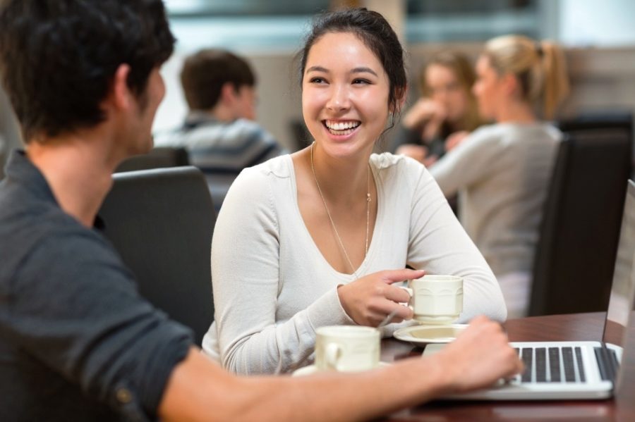 Students chatting in college cafe